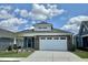 Brick home with a two-car garage and landscaping at 124 Swain St, Clayton, NC 27527