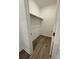 Spacious walk-in closet with wood-look flooring and ample hanging space at 124 Swain St, Clayton, NC 27527