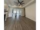 Open concept living room with hardwood floors and kitchen view at 124 Swain St, Clayton, NC 27527
