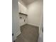 Laundry room with white cabinets and gray tile flooring at 124 Swain St, Clayton, NC 27527