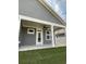 Covered patio with ceiling fan and white columns at 124 Swain St, Clayton, NC 27527