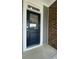 Dark blue front door with glass panel and white trim at 124 Swain St, Clayton, NC 27527