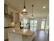 Open concept kitchen with island and stainless steel appliances at 124 Swain St, Clayton, NC 27527