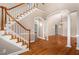 Grand entryway with hardwood floors and a staircase at 5504 Spring Bluffs Ln, Raleigh, NC 27606