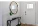 Bright entryway with a large mirror and console table at 724 Apple Churn Dr, Fuquay Varina, NC 27526