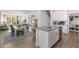 Open concept kitchen with an island and stainless steel appliances at 724 Apple Churn Dr, Fuquay Varina, NC 27526