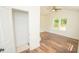 Bright bedroom with wood flooring, a ceiling fan, and a closet at 304 Cherry Grove St, Durham, NC 27703