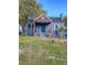 Updated blue house with a landscaped yard and porch at 304 Cherry Grove St, Durham, NC 27703