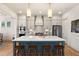 Bright kitchen boasts modern cabinetry, quartz countertops, and stainless steel appliances at 465 Douglas Falls Dr, Wendell, NC 27591