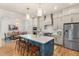 Open concept kitchen with modern cabinetry, a large island, and stainless steel appliances at 465 Douglas Falls Dr, Wendell, NC 27591