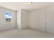 Well-lit bedroom with neutral walls, carpet, and a closet at 465 Douglas Falls Dr, Wendell, NC 27591