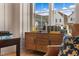 Cozy home office features a mid-century modern credenza and comfortable armchair at 465 Douglas Falls Dr, Wendell, NC 27591