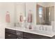Double vanity bathroom with a quartz countertop and modern fixtures at 465 Douglas Falls Dr, Wendell, NC 27591