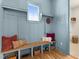 Functional mudroom with built-in bench, cubbies, and stylish pillows at 465 Douglas Falls Dr, Wendell, NC 27591