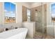 Spa-like bathroom with a large soaking tub and a walk-in shower at 465 Douglas Falls Dr, Wendell, NC 27591