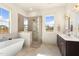 Elegant bathroom with soaking tub, walk-in shower, and double vanity at 465 Douglas Falls Dr, Wendell, NC 27591