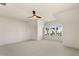 Spacious bedroom with a ceiling fan and window offering a neighborhood view at 465 Douglas Falls Dr, Wendell, NC 27591
