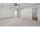 Main bedroom with carpet, ceiling fan, and ensuite bathroom at 1608 Irving Place, Creedmoor, NC 27522
