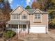 Two-story house with attached garage and porch at 1608 Irving Place, Creedmoor, NC 27522
