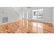 Sunlit living room with hardwood floors and large windows at 1608 Irving Place, Creedmoor, NC 27522