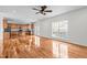Open living room with hardwood floors and kitchen view at 1608 Irving Place, Creedmoor, NC 27522