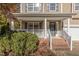 Front porch with brick steps and white railings at 1608 Irving Place, Creedmoor, NC 27522