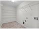 Laundry room with wire shelving and tile floor at 1608 Irving Place, Creedmoor, NC 27522