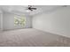 Spacious bedroom with a window and ceiling fan at 1608 Irving Place, Creedmoor, NC 27522