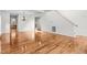 Hardwood floor dining room with kitchen and staircase views at 1608 Irving Place, Creedmoor, NC 27522