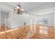 Bright dining room with hardwood floors and elegant chandelier at 1608 Irving Place, Creedmoor, NC 27522