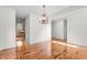 Spacious dining room featuring hardwood floors and a chandelier at 1608 Irving Place, Creedmoor, NC 27522