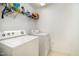 Laundry room with washer, dryer, and overhead shelving at 1412 Hanford Hills Rd, Graham, NC 27253