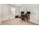 Bright home office features window, carpet, and built-in desk at 1412 Hanford Hills Rd, Graham, NC 27253