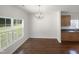 Dining area with hardwood floors, chandelier and window at 3122 Genlee Dr, Durham, NC 27704