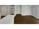 Kitchen features hardwood floors and white cabinets at 3181 Hardie St, Creedmoor, NC 27522