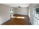 Bright living room featuring hardwood floors and a view into another room at 3181 Hardie St, Creedmoor, NC 27522