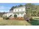Two-story house with light yellow siding, gray roof, and a covered porch at 3181 Hardie St, Creedmoor, NC 27522
