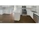 Modern kitchen with white cabinets and stainless steel appliances at 3181 Hardie St, Creedmoor, NC 27522