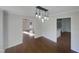 Dining room with hardwood floors and views into adjacent rooms at 3181 Hardie St, Creedmoor, NC 27522