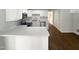 Modern kitchen with white cabinets, stainless steel appliances, and a large island at 3181 Hardie St, Creedmoor, NC 27522