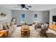 Virtually staged living room features neutral walls, hardwood floors, and ample natural light at 3181 Hardie St, Creedmoor, NC 27522