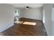 Bright living room featuring hardwood floors and a view into another room at 3181 Hardie St, Creedmoor, NC 27522
