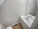 Small bathroom with white vanity and a speckled countertop at 3181 Hardie St, Creedmoor, NC 27522