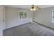 Spacious bedroom with carpet flooring and a large window at 3181 Hardie St, Creedmoor, NC 27522
