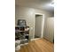 Cozy bedroom with built-in shelving and wood floors at 327 Ranch Farm Rd, Raleigh, NC 27603