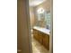 Clean bathroom with wood vanity, tiled floor and bathtub shower at 327 Ranch Farm Rd, Raleigh, NC 27603