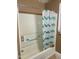 Bathroom with bathtub, shower, and teal chevron shower curtain at 327 Ranch Farm Rd, Raleigh, NC 27603