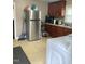 Bright kitchen features ample cabinetry and includes a refrigerator, stove and washer/dryer at 327 Ranch Farm Rd, Raleigh, NC 27603