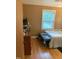 Bedroom with wood flooring, dresser, and a queen-size bed at 327 Ranch Farm Rd, Raleigh, NC 27603