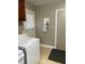 Convenient laundry room with washer and dryer, and exterior access at 327 Ranch Farm Rd, Raleigh, NC 27603